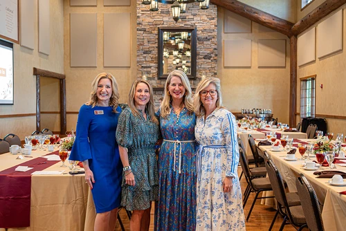 Four ladies standing together